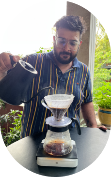 Something's Brewing Customer brewing coffee in a manual brew