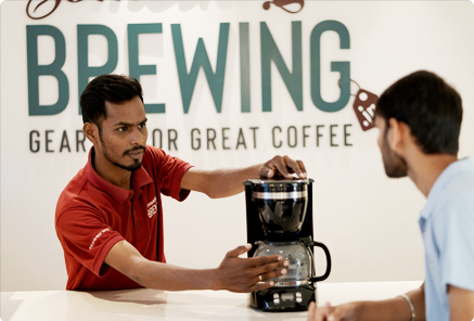 Somethings Brewing barista explaining brewing method to a customer
