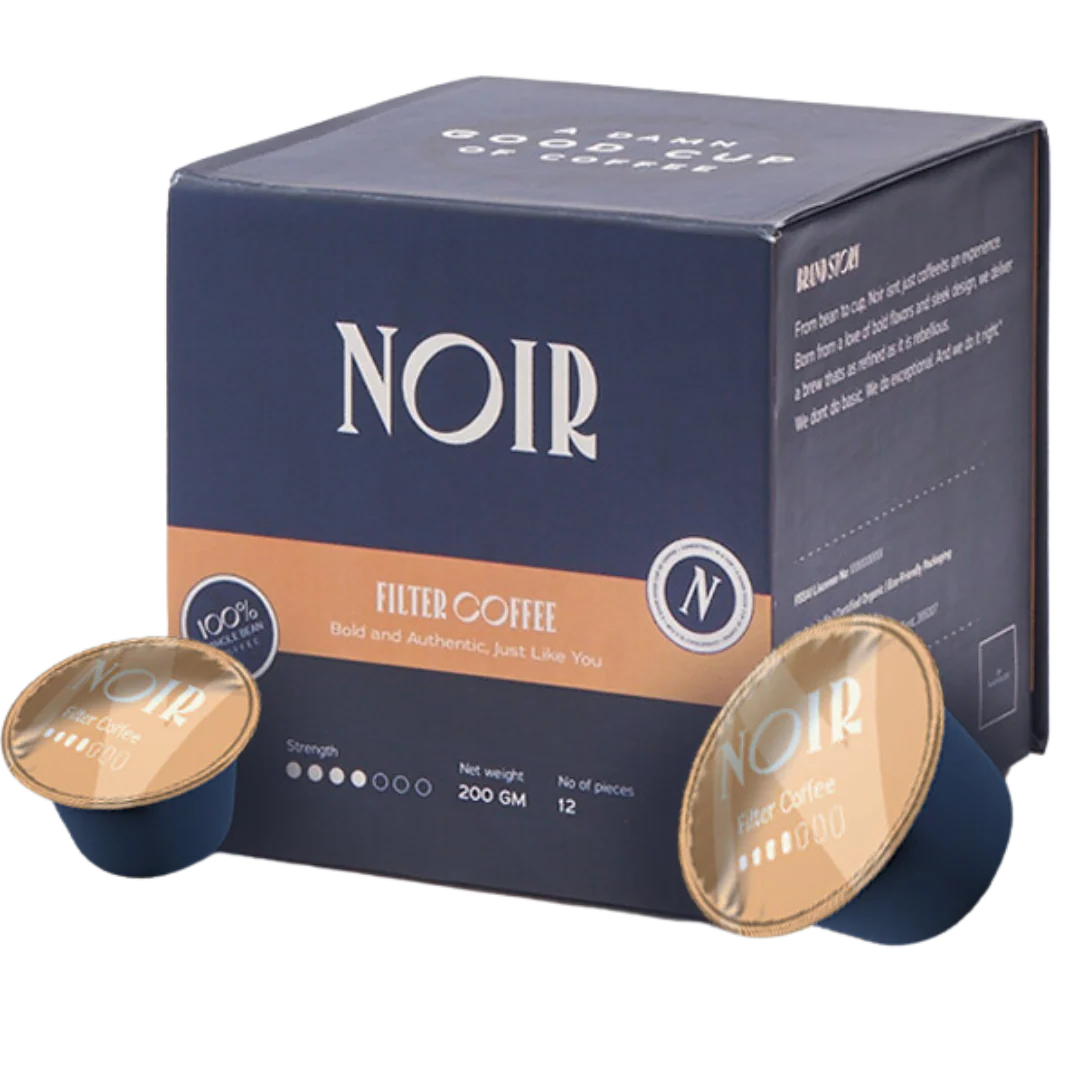 NOIR filter coffee packaging with two coffee pods on a white background