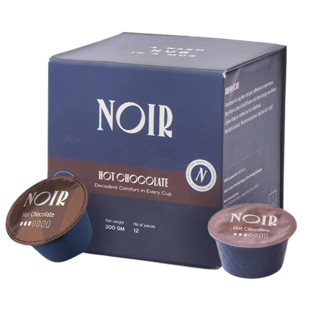 NOIR hot chocolate packaging with two capsules on a white background